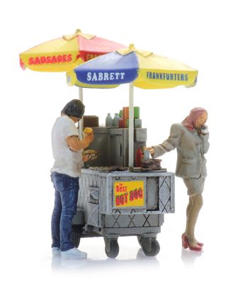 Picture of NYC hot dog cart + two figures